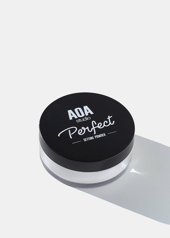 white setting powder in a clear container with a black lid